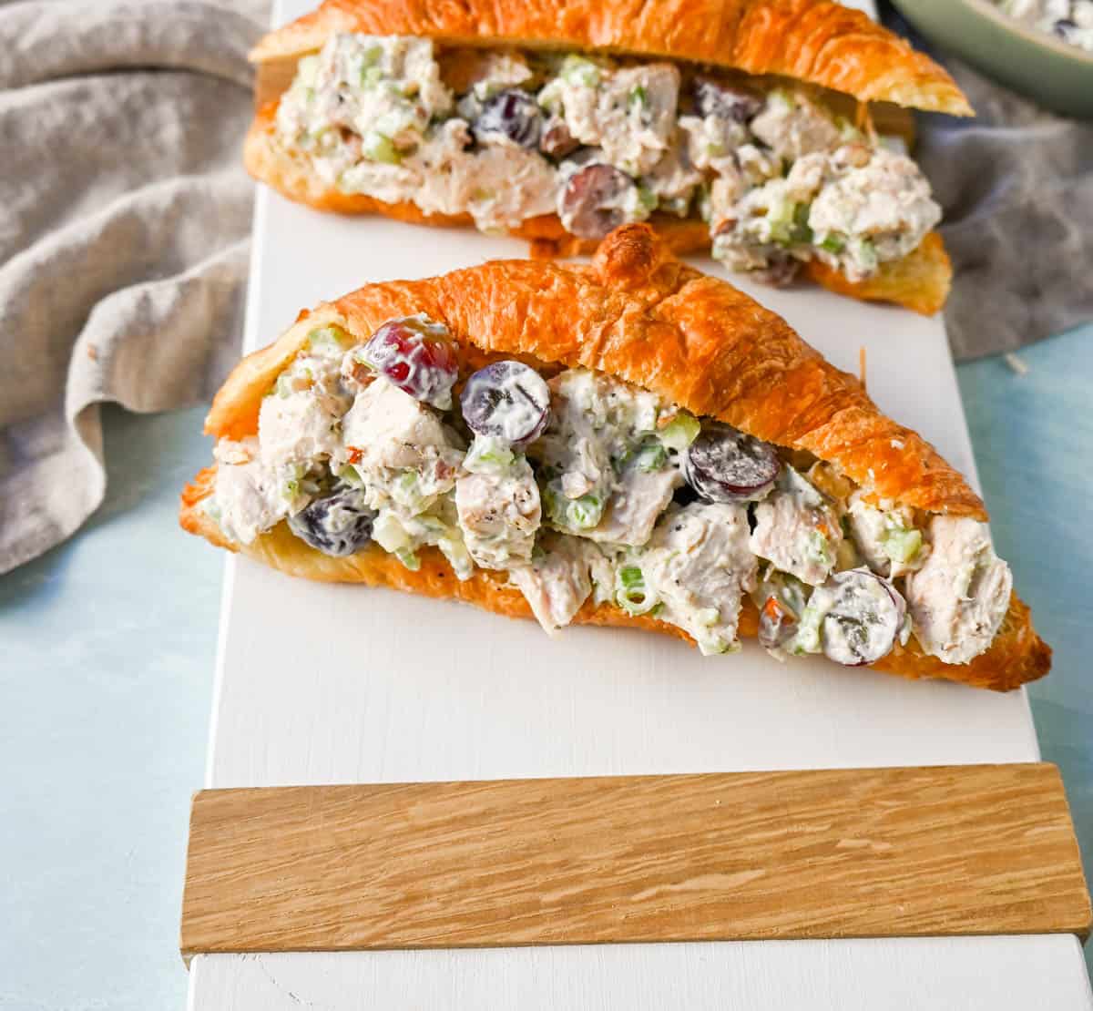 Creamy Homemade Chicken Salad made with tender chicken, crunchy celery, green onion, sweet grapes, and crunchy almonds in a mayonnaise dressing. This is a classic chicken salad recipe that everyone loves and is perfect for a quick lunch or potluck.