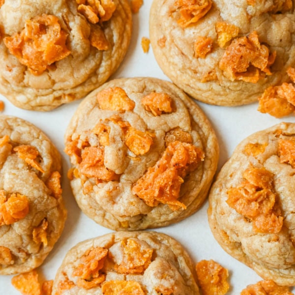 These Cornflake Crack Cookies are buttery, chewy, crispy cookies with toffee caramel notes thanks to homemade cornflake crack in and on top of the cookies. These sweet and salty cookies are always a hit!