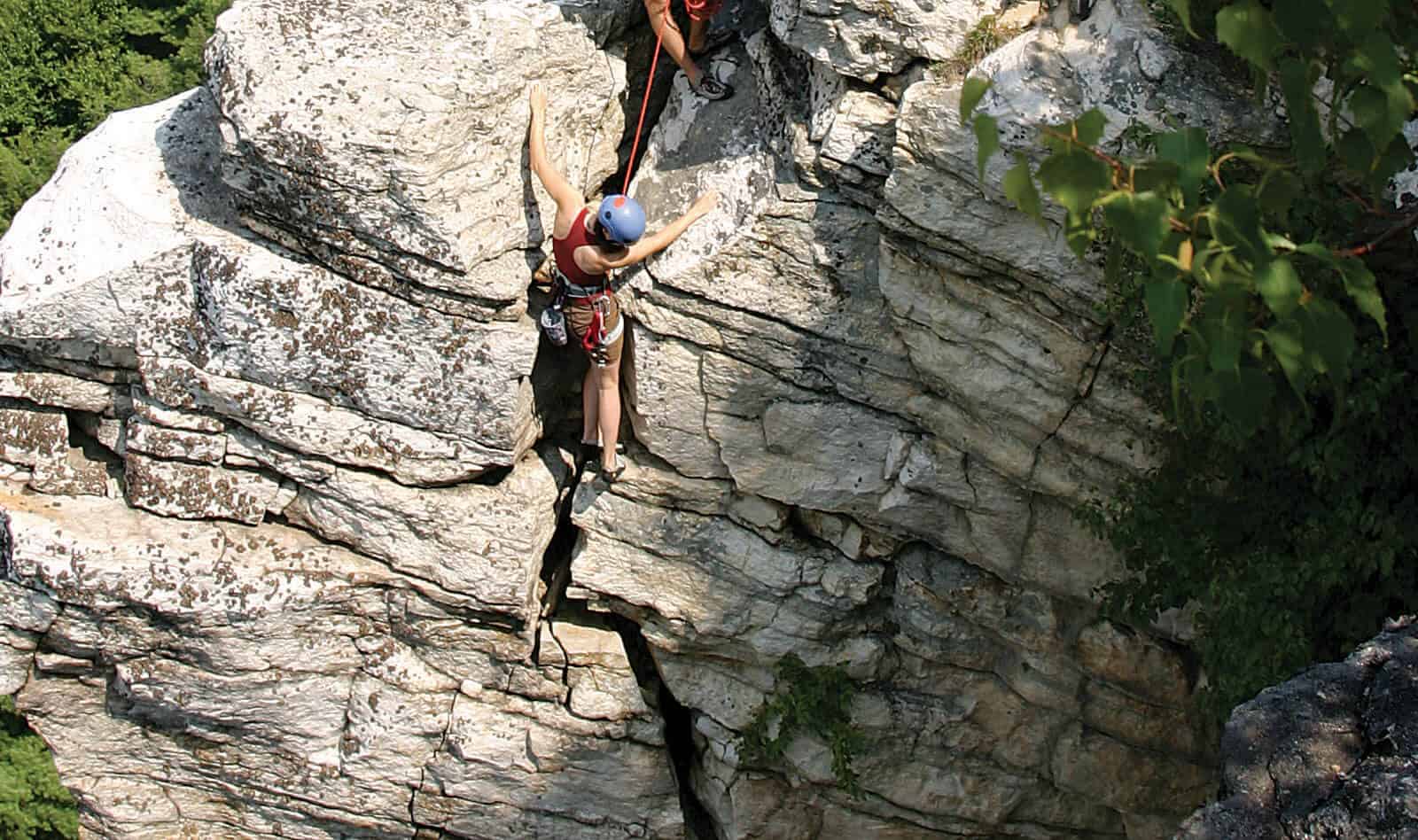 Young girl rock climbing