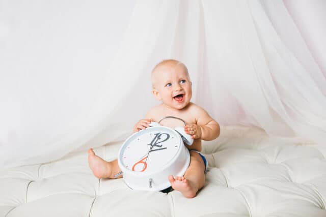 baby with clock