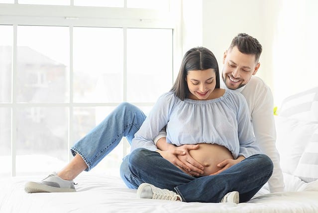 Beautiful pregnant couple at home