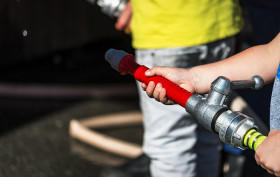 Stock Image: fire hose in child hand