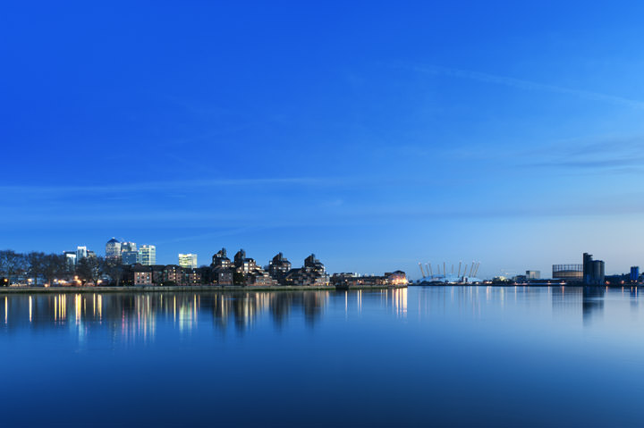  Isle of Dogs and the O2 centre in blue light from the River Thames at Greenwich