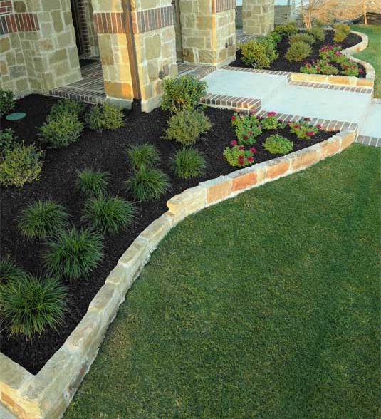 Image of Black rubber mulch in a container