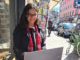 Nadja Donderer sitting outside and looking into her laptop during her online semester abroad at ISB Dublin