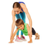 Little boy doing Push-Ups with his mother