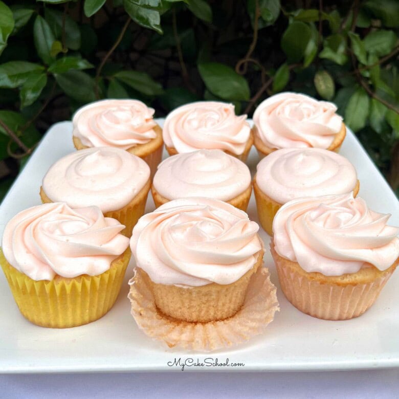 Pink Champagne Cupcakes on a cake platter.