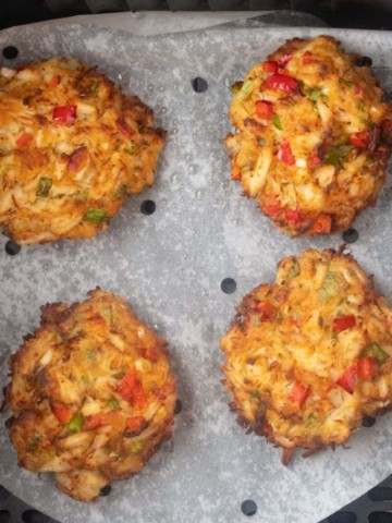 cooked air fryer crab cakes in an air fryer basket