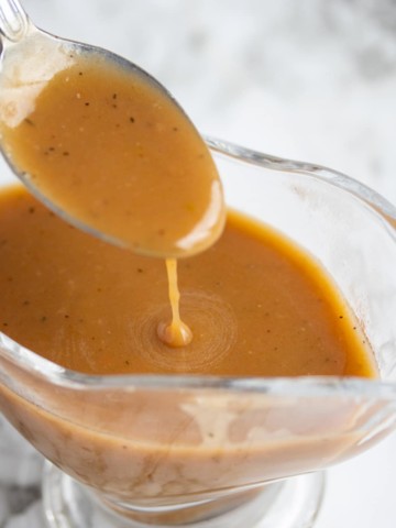 spoon lifting gravy out of gravy dish