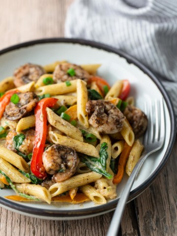 rasta pasta on plate with fork on side