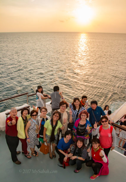 Tourists enjoying the sunset view