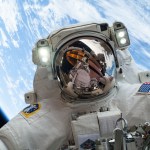 NASA astronaut Mike Hopkins in a spacesuit outside of the International Space Station during a spacewalk.