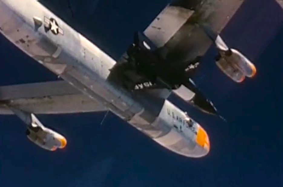 The B-52 carries the X-15 and Crossfield to the drop altitude. 