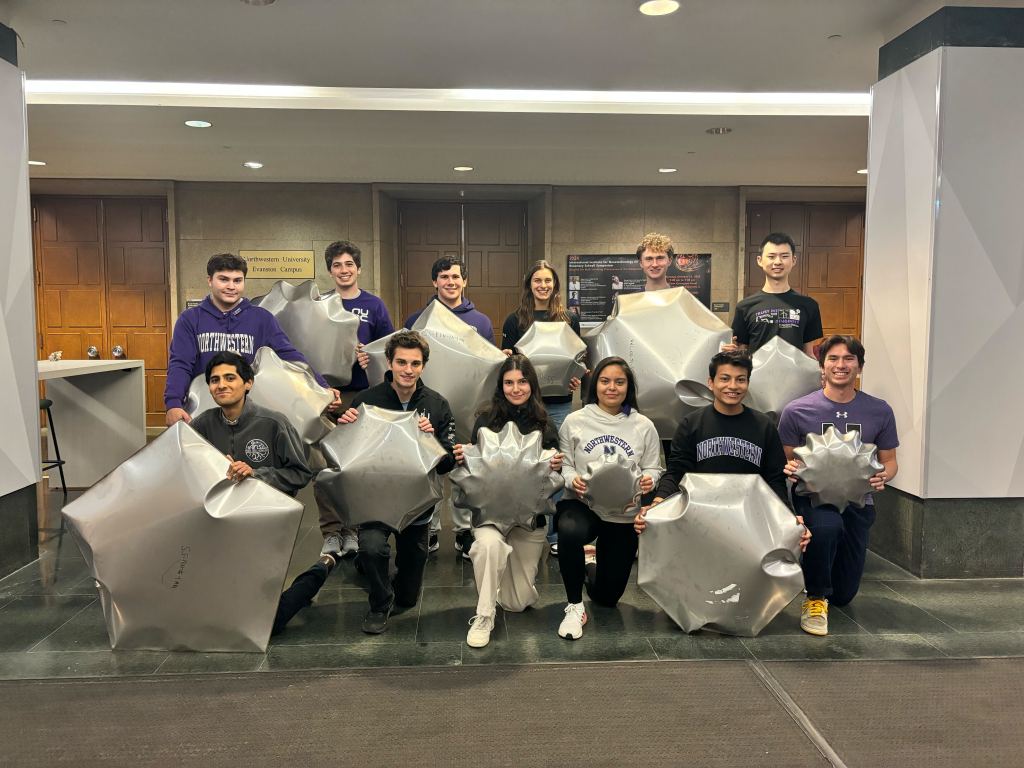 Northwestern University team members pose with lunar inflatable prototypes from their METALS project in NASA’s 2024 BIG Idea Challenge.