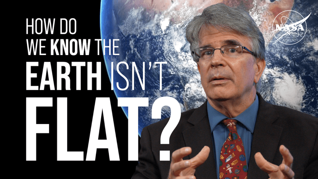 The image features a man wearing glasses, speaking with a serious expression. He is wearing a dark suit, a blue shirt, and a colorful tie with images of planets and rockets. The background shows a satellite image of Earth from space, with visible clouds and continents. On the left side of the image is large, bold white text asking about the Earth's shape. In the top right corner, a NASA logo is visible in white.