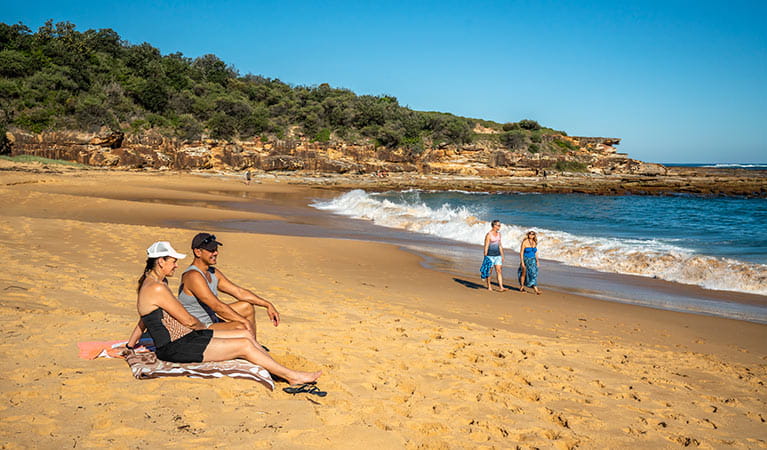 People sunbathing at Putty Beach. Photo: John Spencer/DPIE