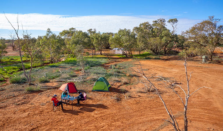 Campers playing cards near their tents at Mount Wood campground. Photo: John Spencer/DPIE