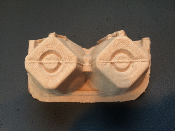 Two egg carton pieces make eyes