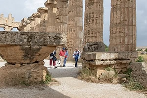 people walking inside an ancient temple