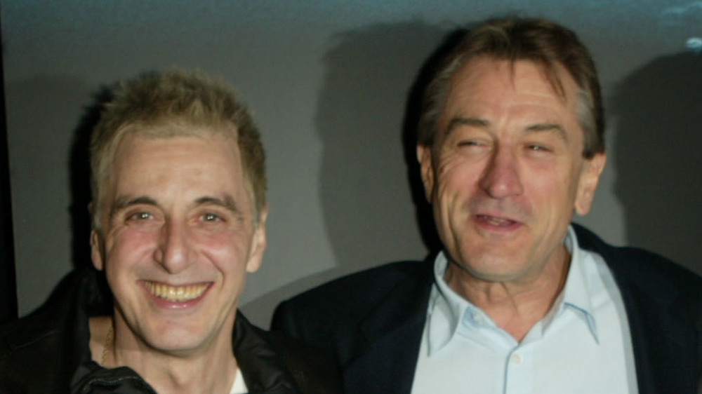 Al Pacino and Robert De Niro pose together in 2002 