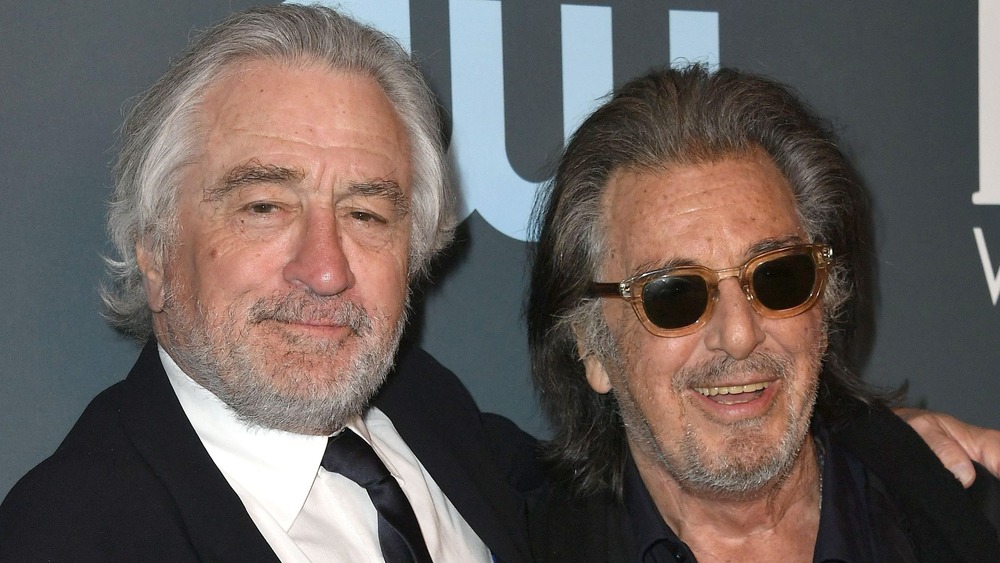 Robert de Niro and Al Pacino smile together on the red carpet