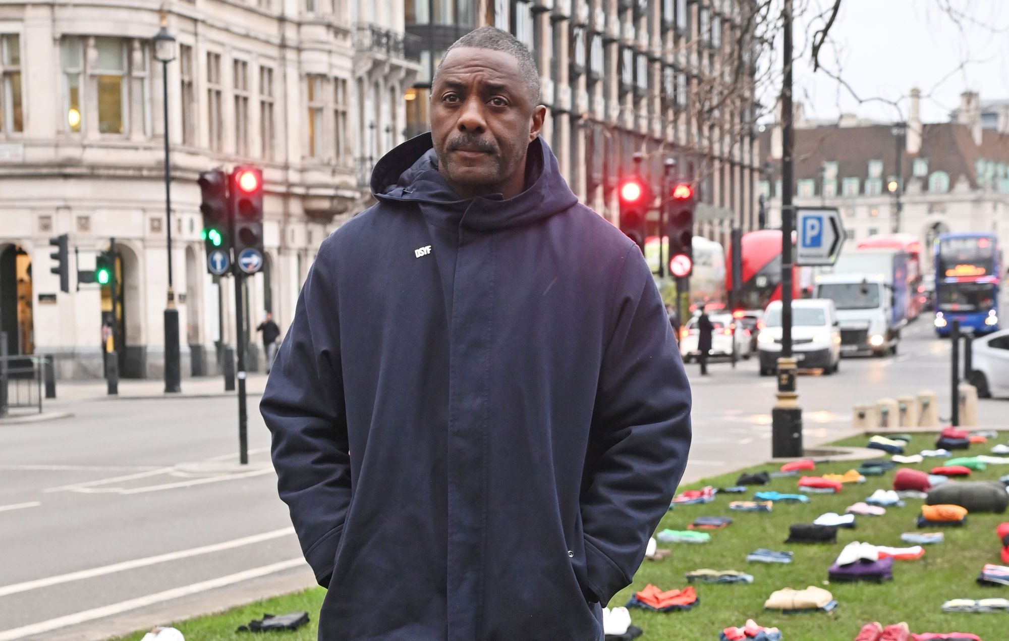 Idris Elba poses in front of an installation of over 200 bundles of clothing representing the lives lost to knife crime in the UK as he calls on the Government to take immediate action to prevent serious youth violence at Parliament Square on January 8, 2024 in London, England.