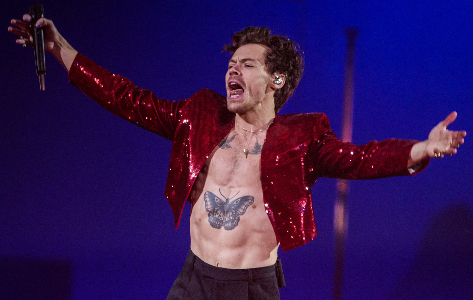 Harry Styles performing live on stage