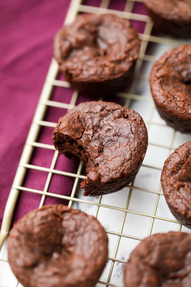 a bite taken out of a brownie bite on cooling rack