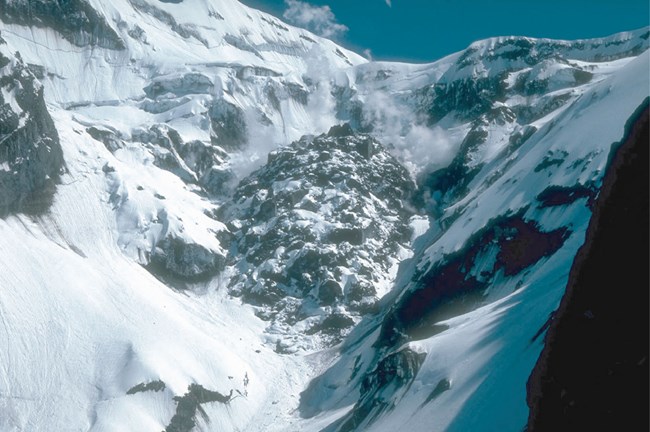 a dome of blocky rock in snowy gulch