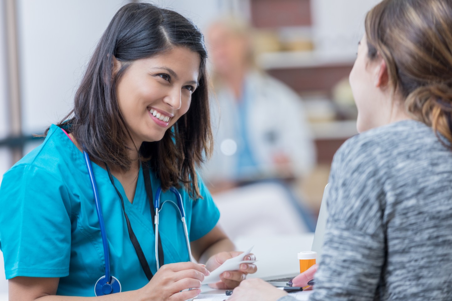 nurse discussing medication with patient