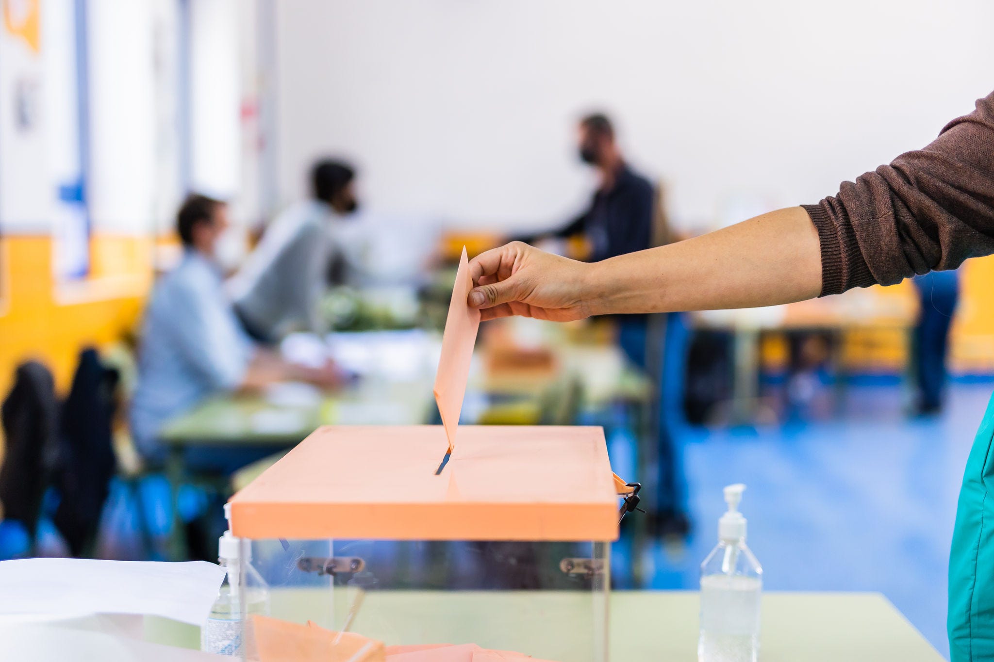 Image of people voting to highlight the concept of trust and democracy