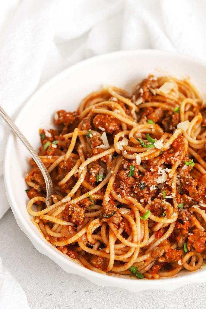 Gluten-free spaghetti tossed with gluten-free spaghetti sauce and parmesan cheese