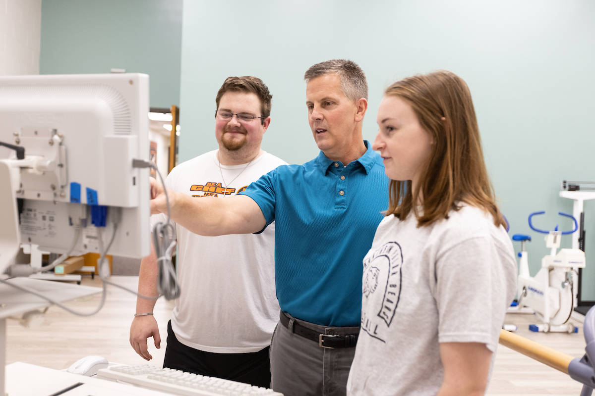 Professor Scott Swanson assisting students