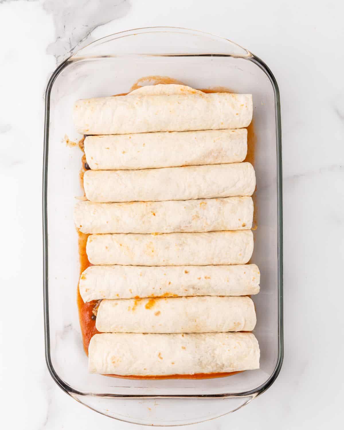 all of the tortillas in a casserole dish.