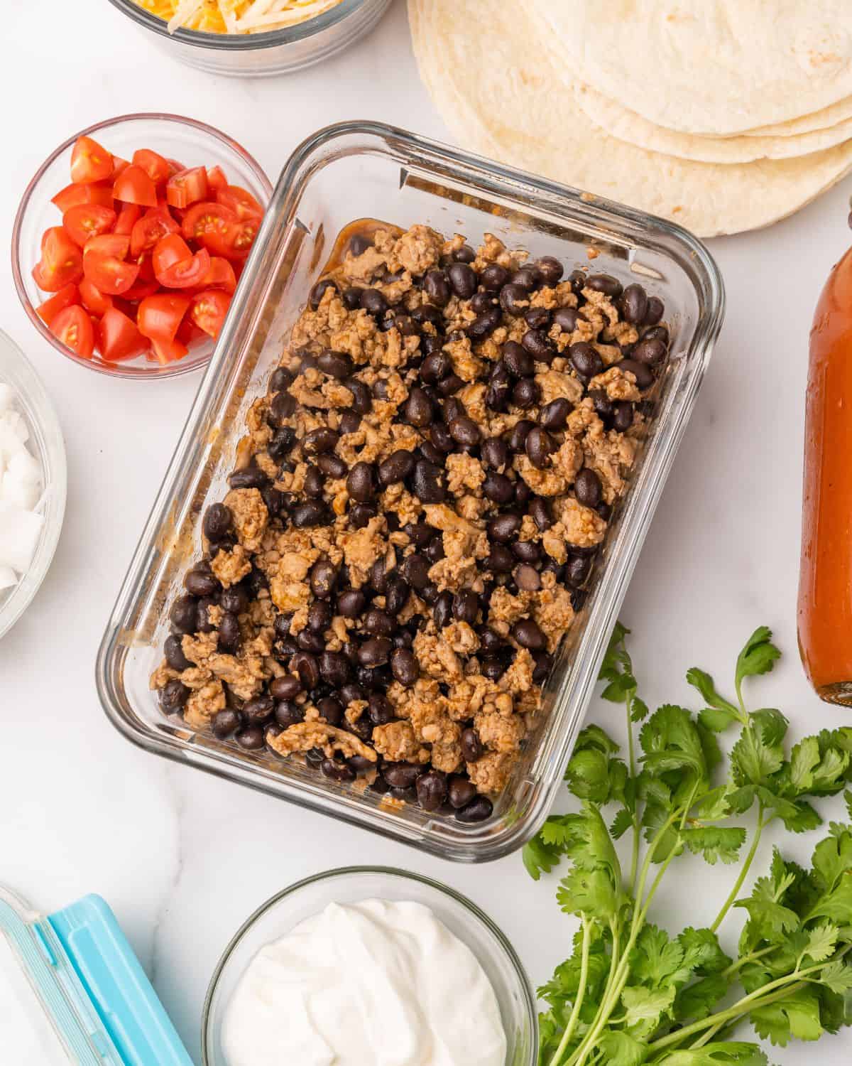 turkey enchilada filling in a meal prep container.