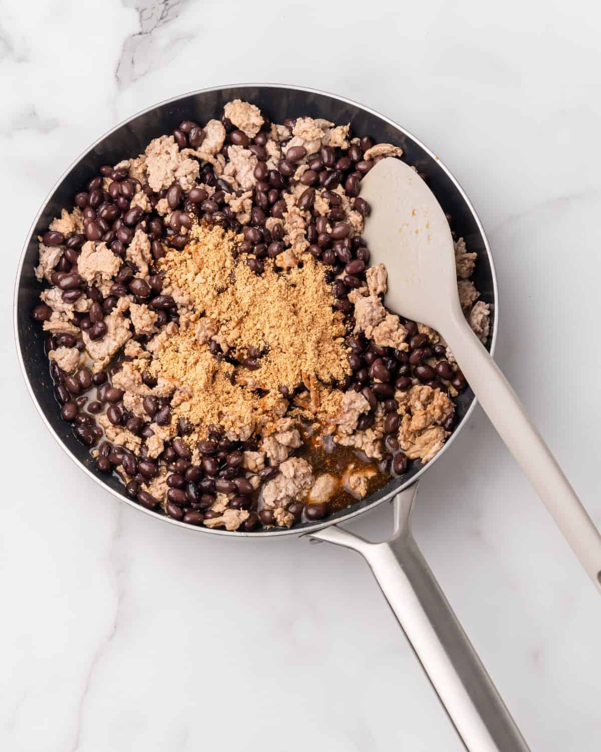 taco seasoning in with the black beans and ground turkey.