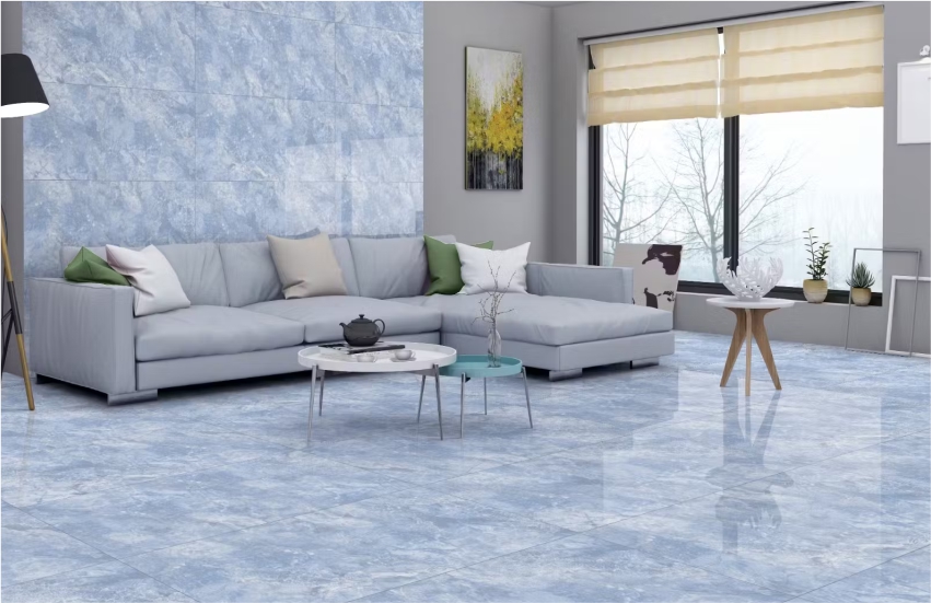 Modern living room with blue marble-look tiles, gray sectional sofa, and large windows