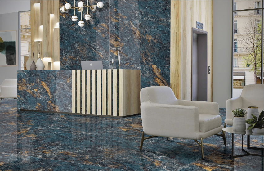 Modern lobby with blue-brown marble tiles, wood reception desk, and white chairs