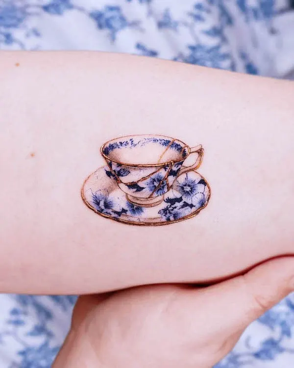 Cute small kintsugi cup tattoo by @vismstudio