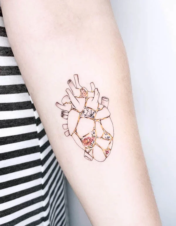 Intricate kintsugi heart tattoo by @stefania.camelia