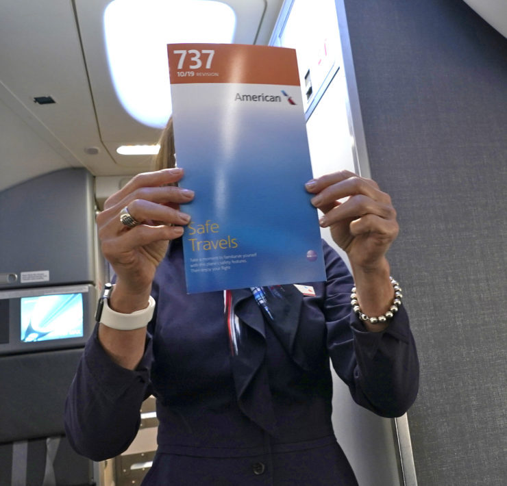 a woman holding a book in front of her face