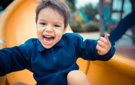 Kid going down slide