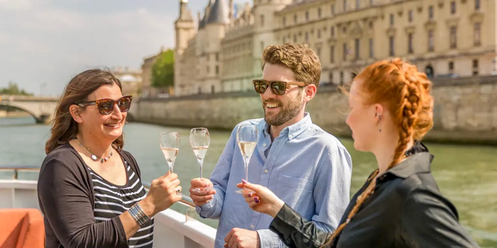 Three people on Champagne Cruise in Paris along the river Seine