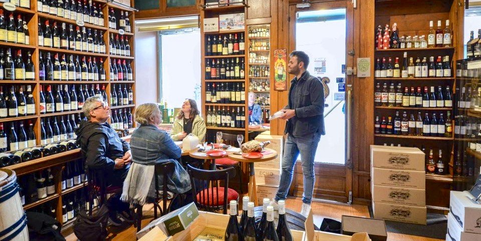 A tour guide leads a tasting during Champagne & Food Tour through St-Germain-des-Pres