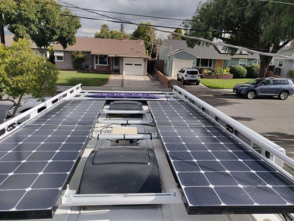 Ford Transit camper van build roof rack with solar panels and fans