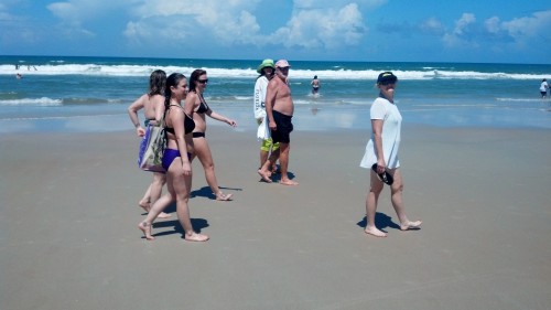 group walking on the beach