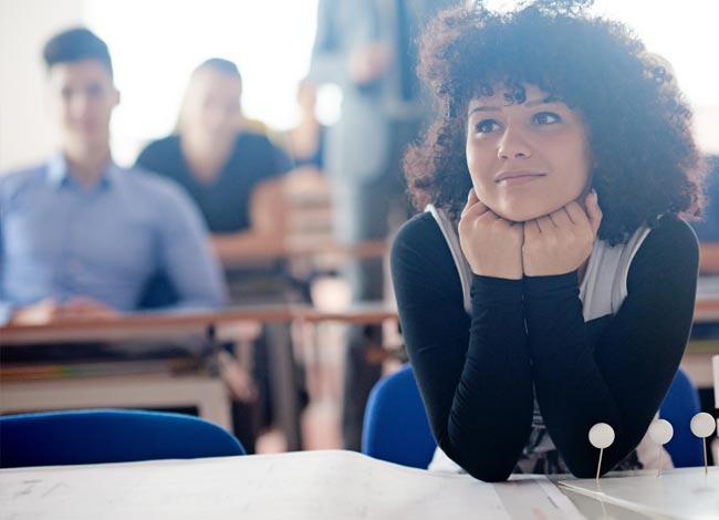 Young female intently listening to a lecture