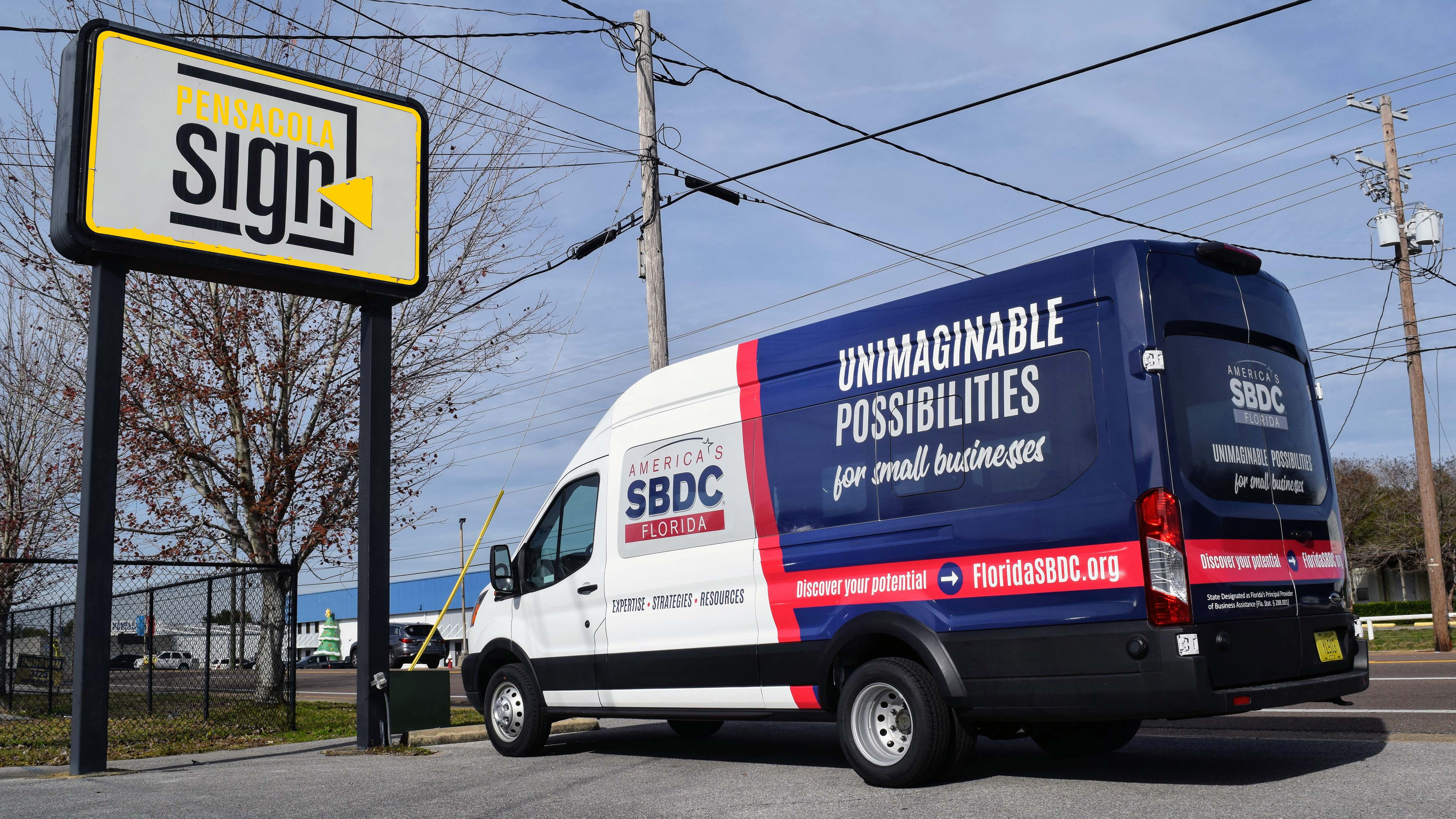 Pensacola Sign Fleet wraps - SBDC large van wrap