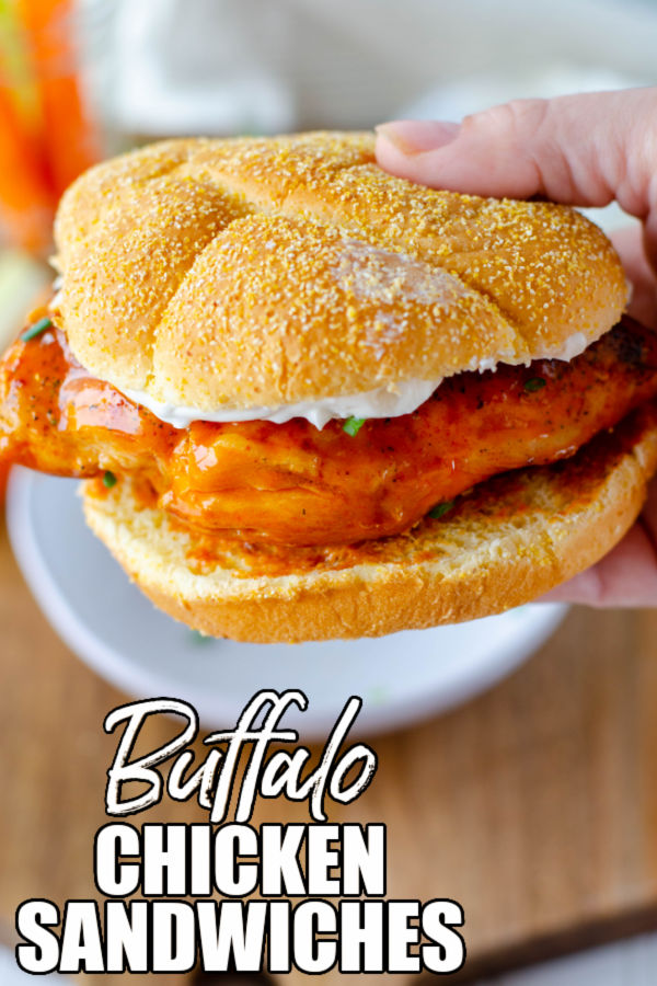 hand holding a buffalo chicken sandwich