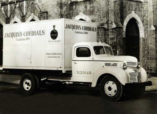 Ford Specialized utility truck parked outside in front of a building in 1927. 